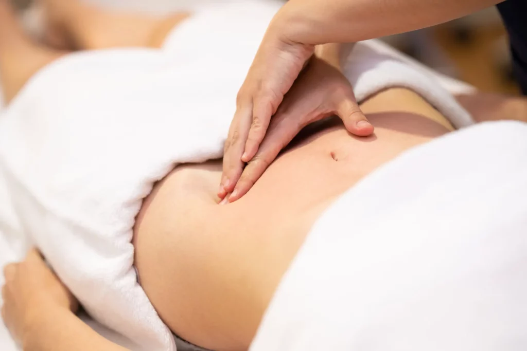 woman receiving a belly massage in a physiotherapy 2021 08 28 00 44 21 utc