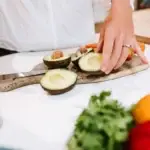 Lindsay Montgomery, Nutritionist at Beaconsfield Health Hub, cutting avocado