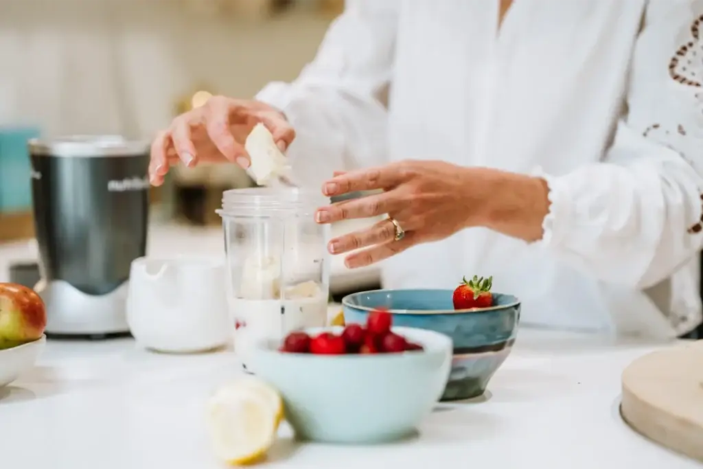 Lindsay preparing bright red strawberries